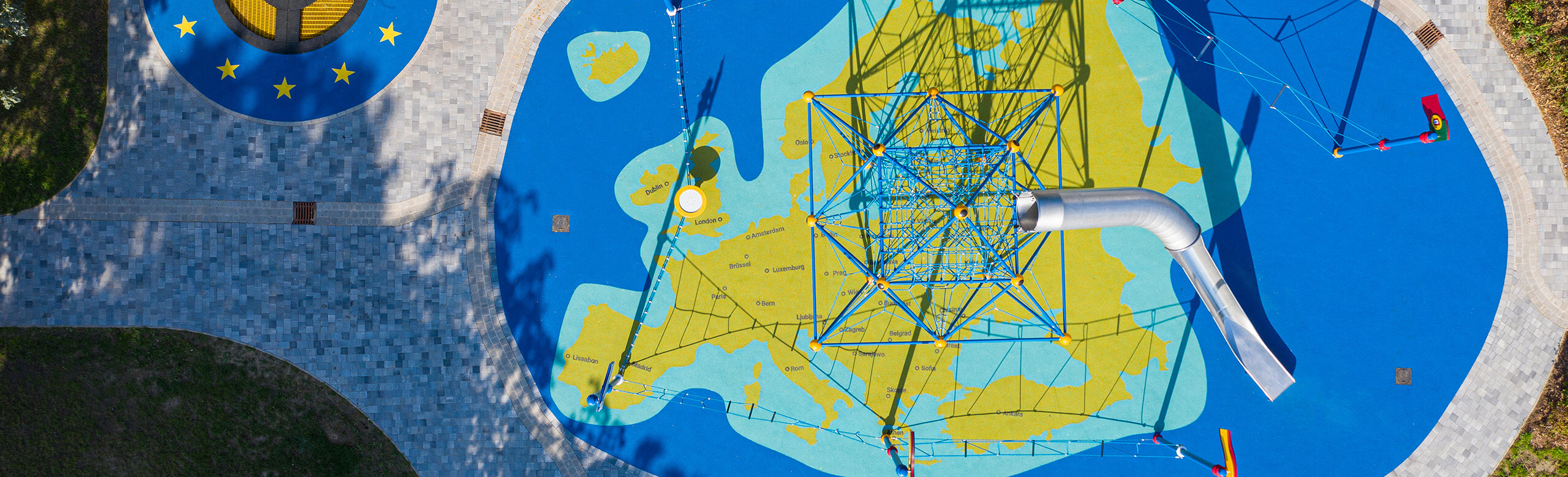 Playground with a safety flooring that looks like a world map from REGUPOL